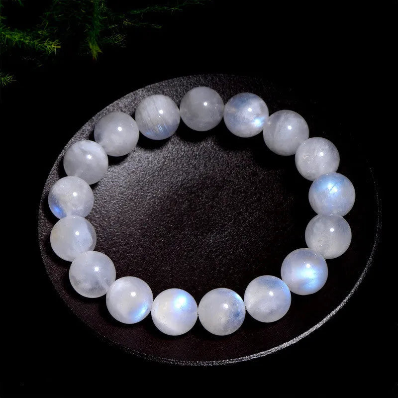 Blue moonlight polished moonstone bead bracelet with round beads in geometric arrangement