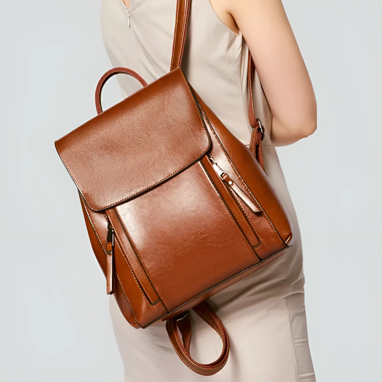 Large genuine leather women's backpack in black with internal organiser pockets and double straps