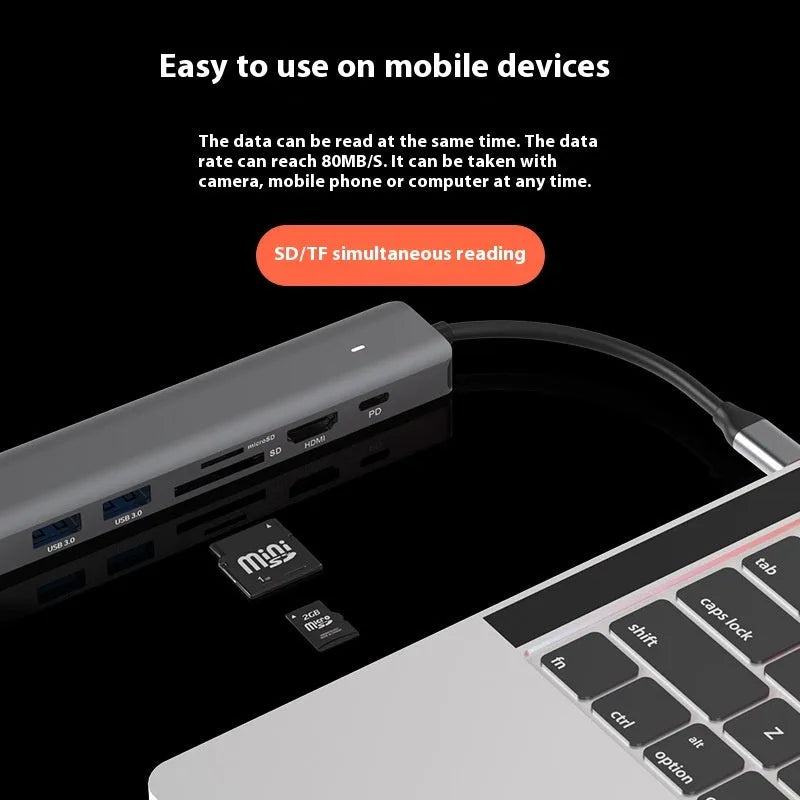 Black USB-C 7-in-1 computer hub with HDMI, USB ports and memory card slots