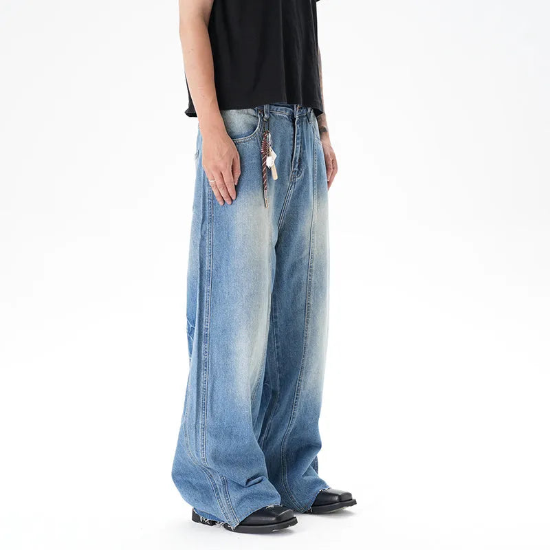 Light blue vintage washed wide leg machete jeans with a straight fit and zipper fly on a model.