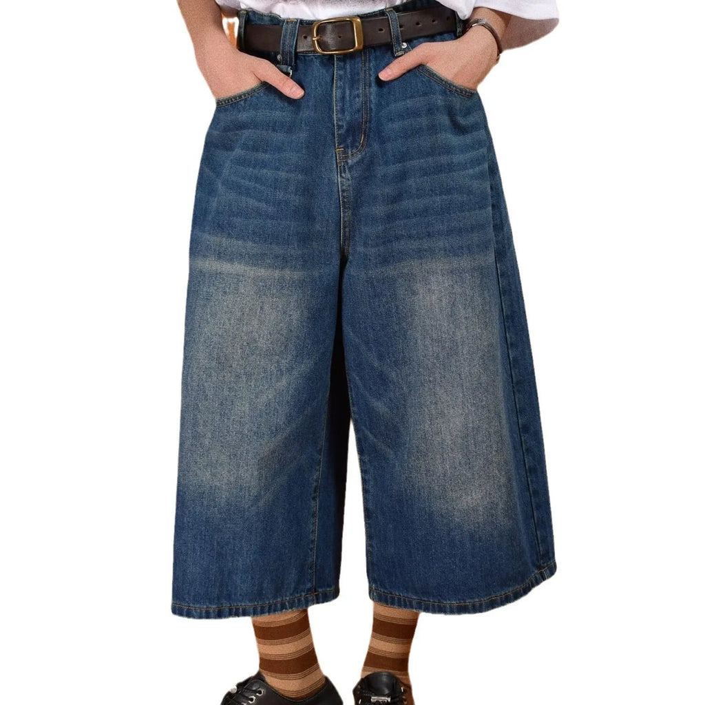 Men's loose-fit straight-leg denim shorts in blue, shown on a model for summer.