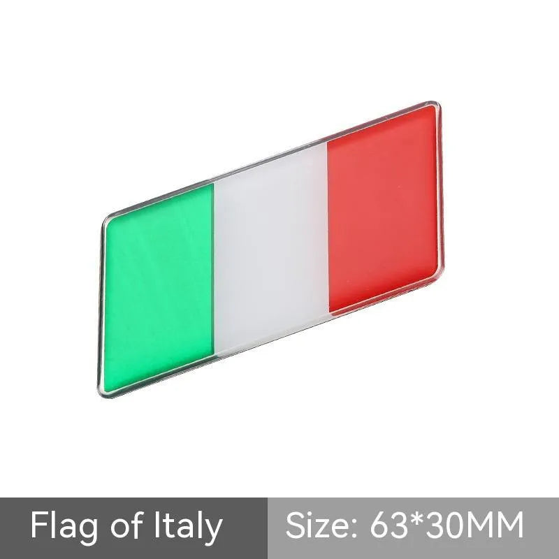 Aluminium parallelogram car sticker with national flag design measuring 6.3 by 3 cm