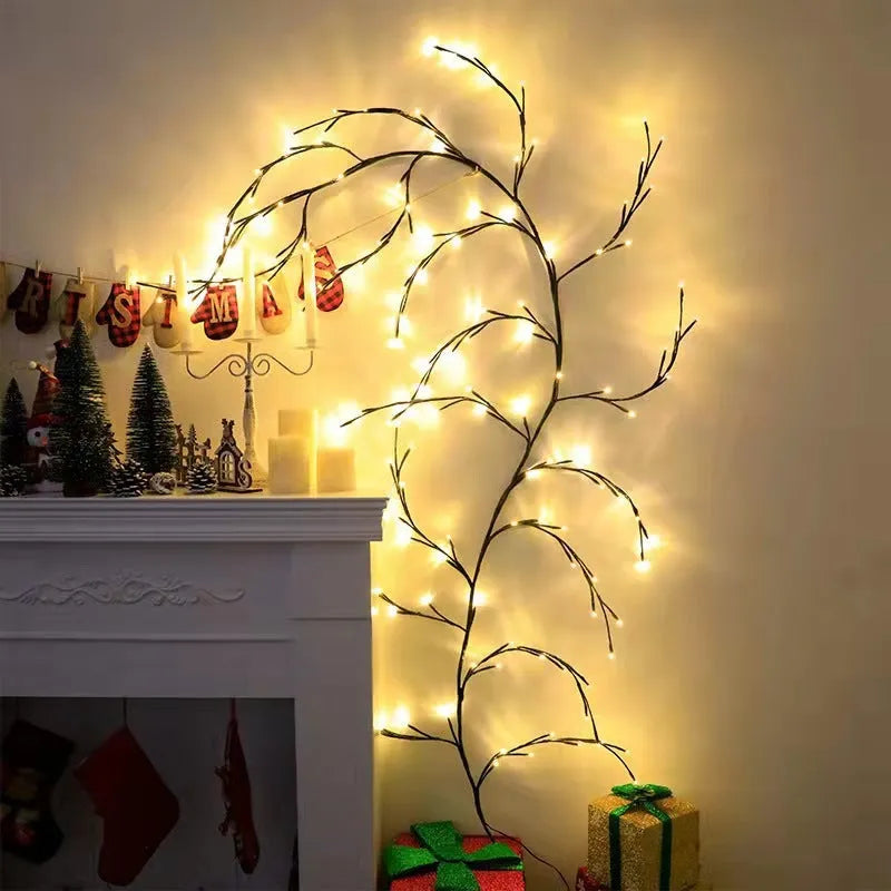 Flexible willow vine LED garland with birch bark texture and warm white lights shaped on a wall.