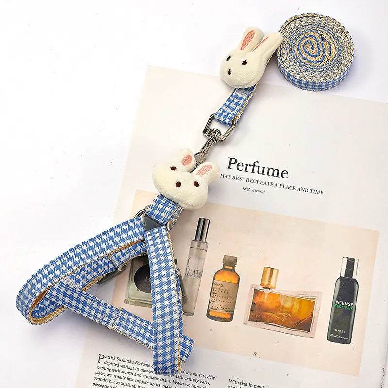 Quick release anti-pull nylon harness and leash for a small dog in blue.