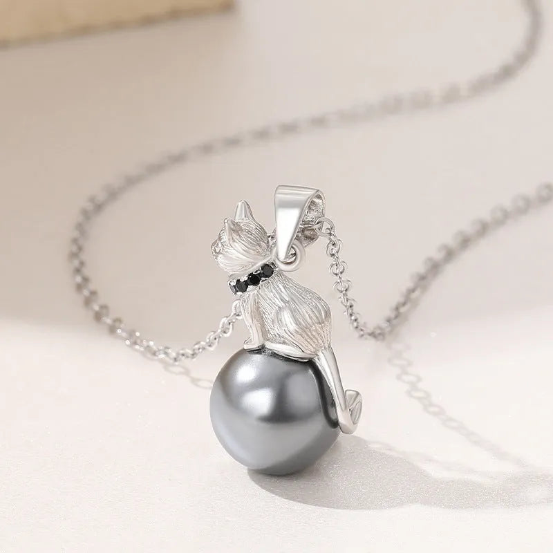 Close-up of a sterling silver cat pendant on a chain, showing the D2113 or D2114 finish variant.