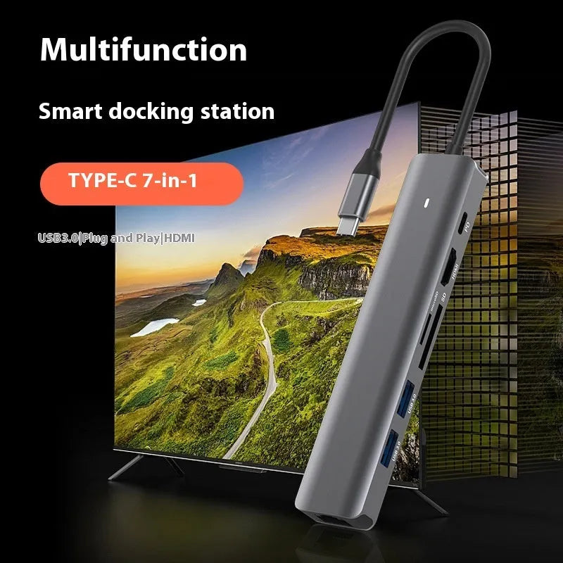 Black USB-C 7-in-1 computer hub with HDMI, USB ports and memory card slots