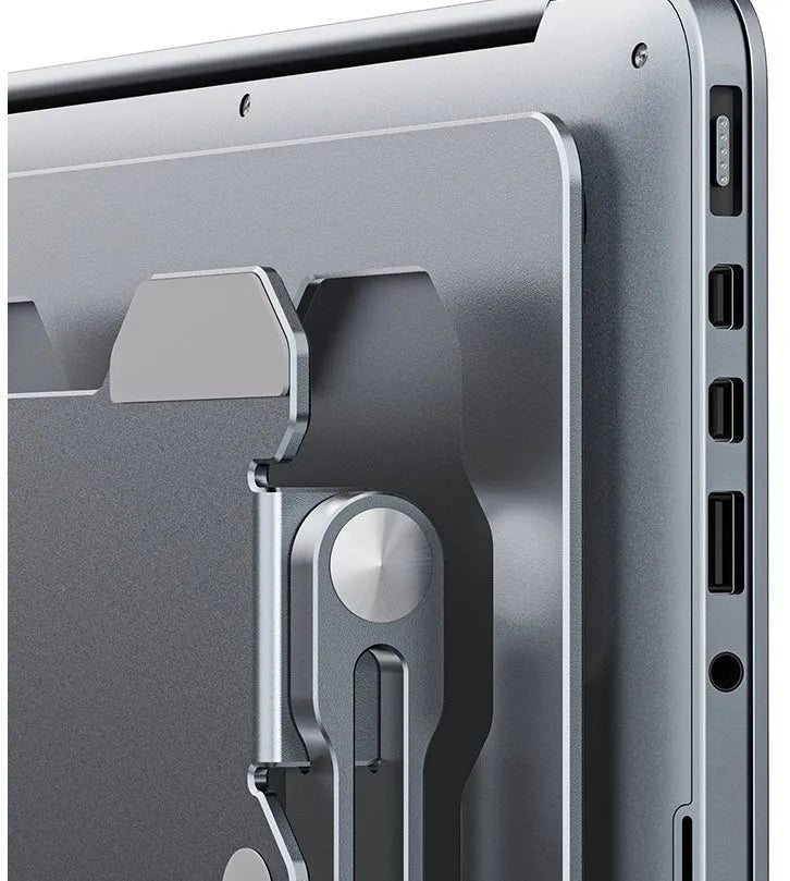 Grey aluminum laptop stand shown at an adjustable angle, folded flat, and holding a silver laptop.
