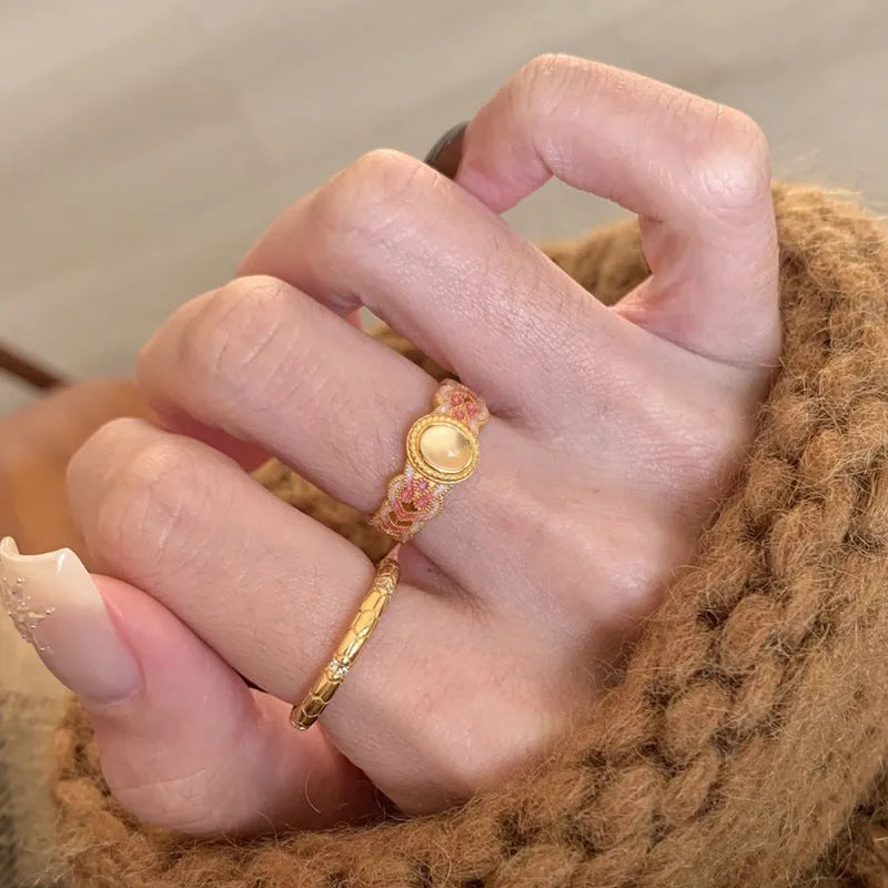 Geometric pink crystal enamel open ring for women on a copper band with gold plating.