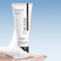 White bottle of 100ml whitening and freckle removing facial cleanser for unisex use.