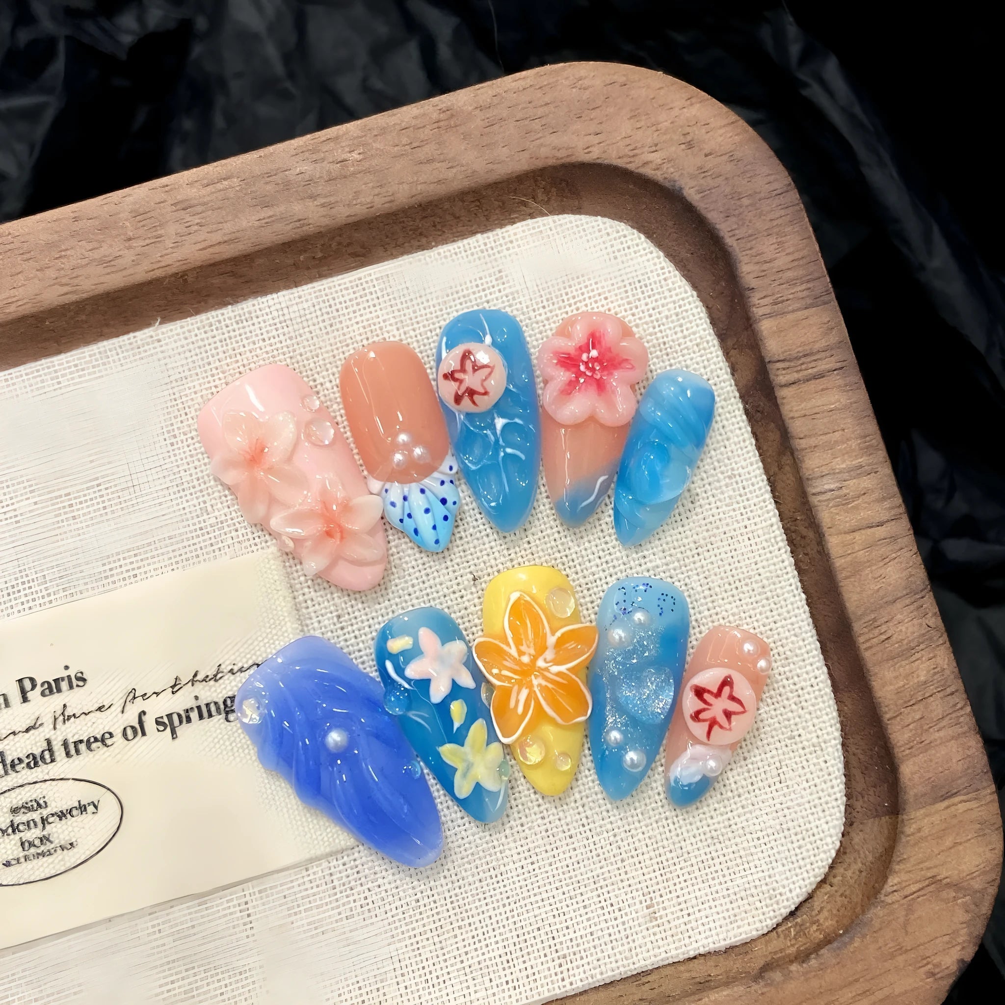 Three-dimensional carved jellyfish marine style wearable armour set in almond nail colour