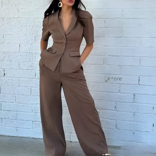 Brown slim fit two-piece suit with long sleeves and matching trousers on a hanger.