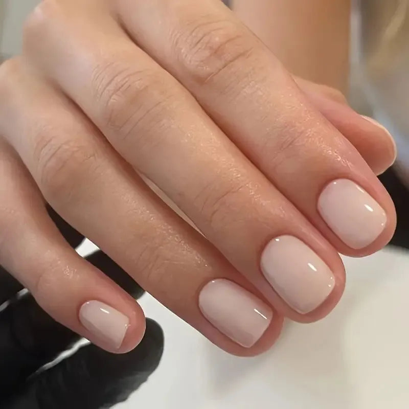 A set of solid light pink false nails (colour MY119) arranged on a card, showcasing their cute style and plastic construction.