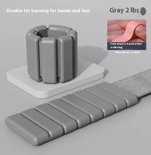 A black silicone weight-bearing bracelet with Velcro fastening, shown with 1lb and 2lb weight options.
