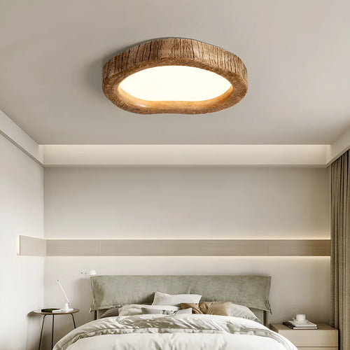 Round wood grain finish ceiling lamp in New Chinese style hanging from a ceiling.
