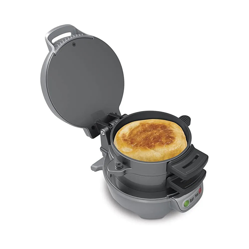Silver grey household breakfast machine sandwich toaster with waffle plates and egg cooker ring on a kitchen counter.
