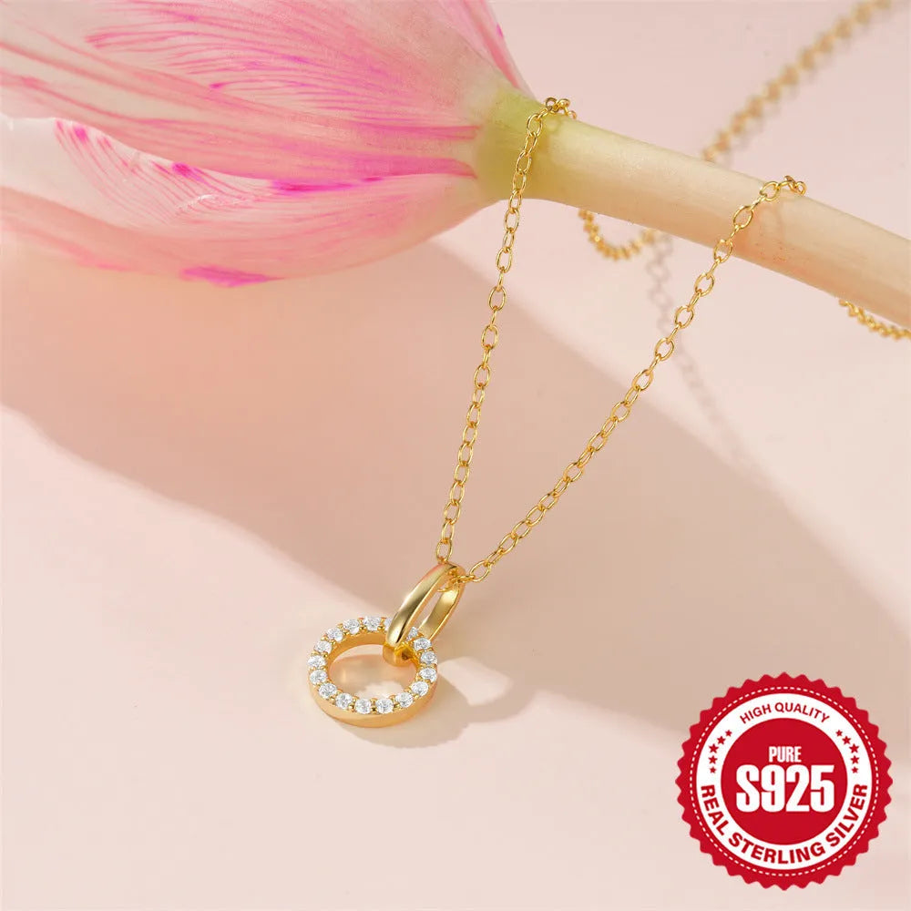 Gold colour sterling silver clavique chain necklace with interlocking zircon design on model