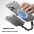 Grey magnetic mobile solid state drive with ultra-thin design next to C to C cable and magnetic suction ring