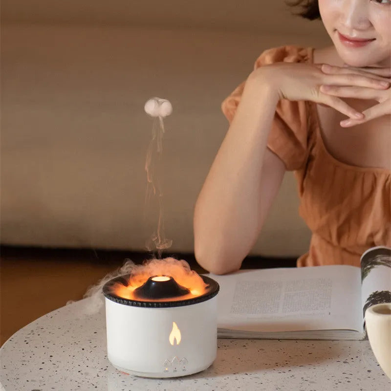White volcano-shaped humidifier emitting a two-colour mist spray ring.