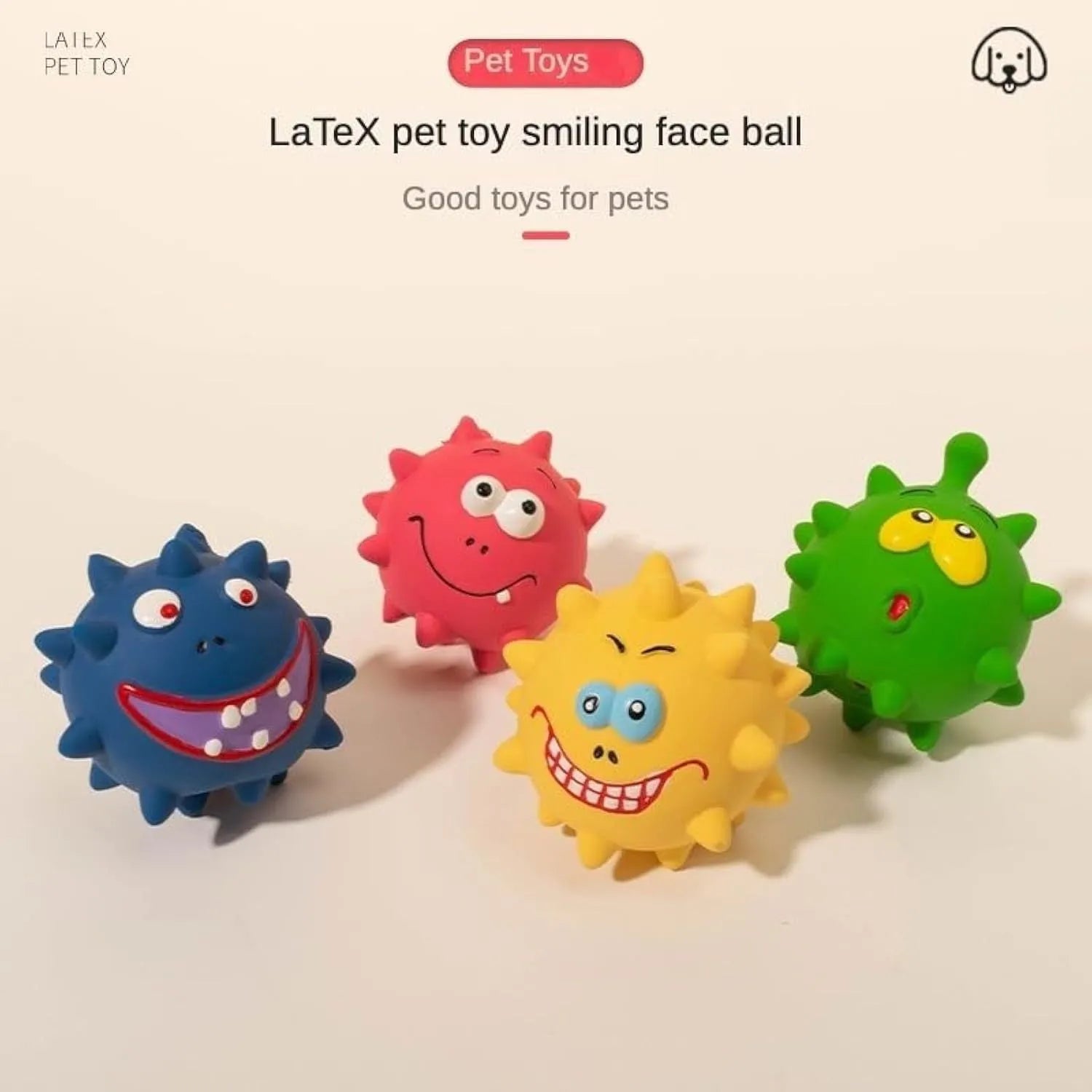 Four colourful squeaky dog balls with cute faces made from natural latex rubber with textured surfaces