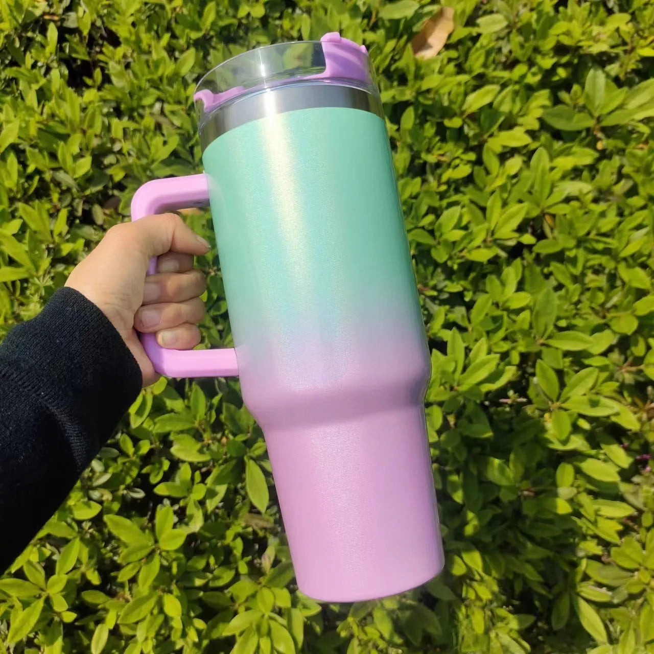 Large stainless steel vacuum insulated cup in a gradient colour option showing its height and simple style.