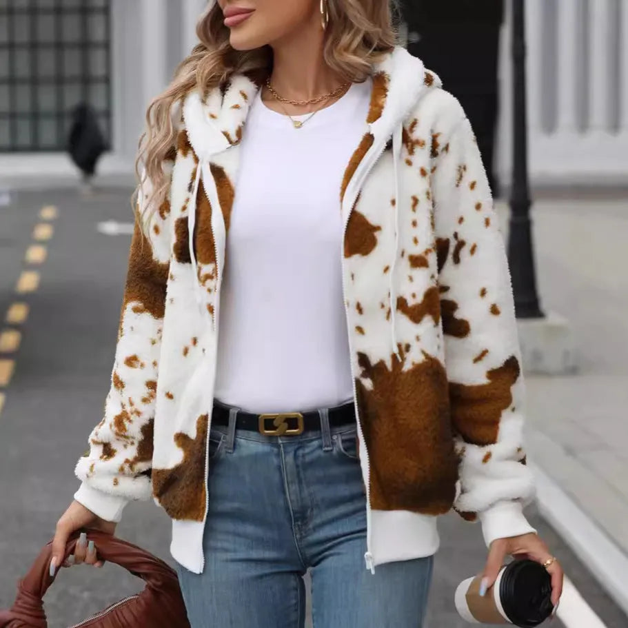 A man's yellow and brown cow print hooded cardigan jacket with a front zipper.