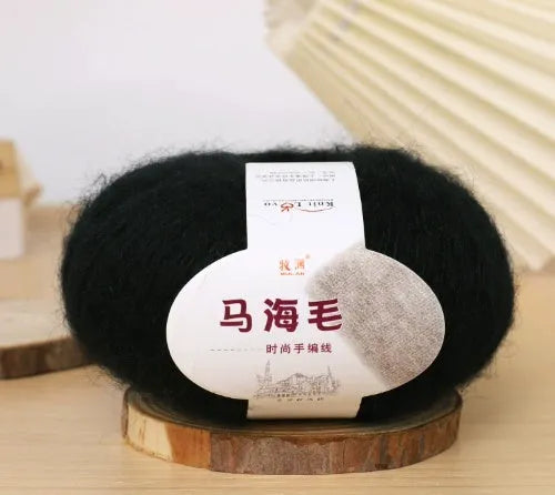 Single ball of mohair yarn in various colours for hand-woven DIY scarf knitting projects