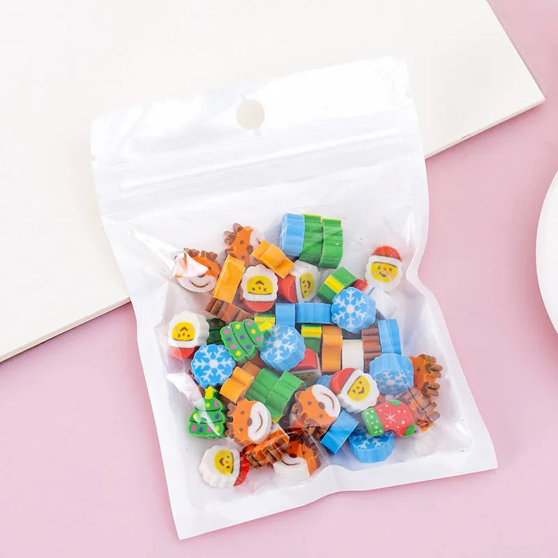 50 colourful cartoon mini erasers in pearlescent bags showing fruit, animal, and holiday designs