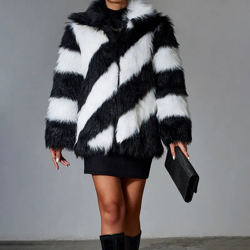 Women's faux fur coat with contrasting lapel detail and a detachable fur collar.