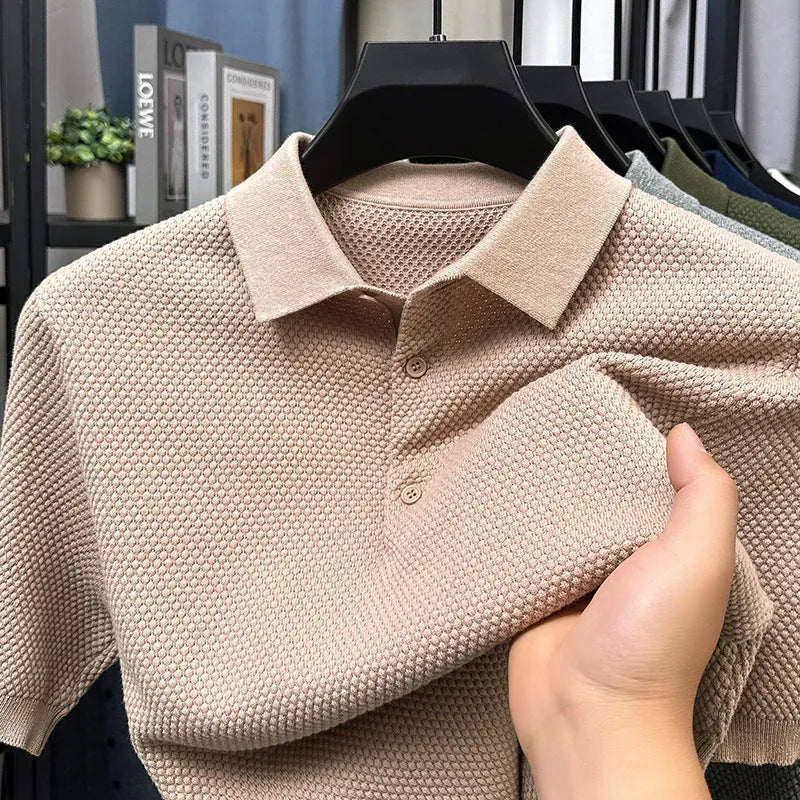 Loose fitting short sleeve cotton sweater in a neutral colour, showing pullover style and casual fit.
