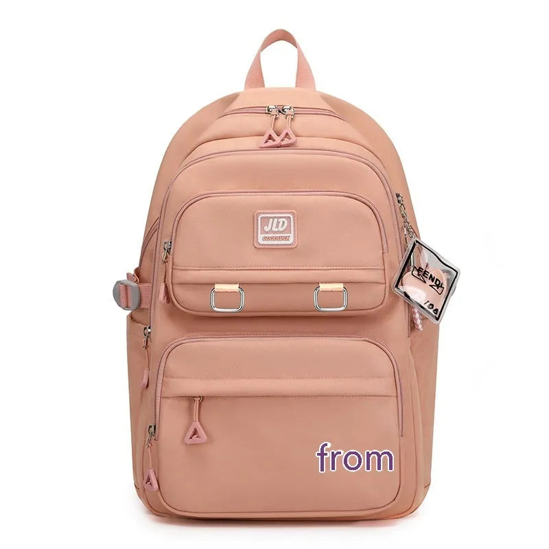 Large purple girls' nylon school backpack with a physiological curve backpanel on a white background.