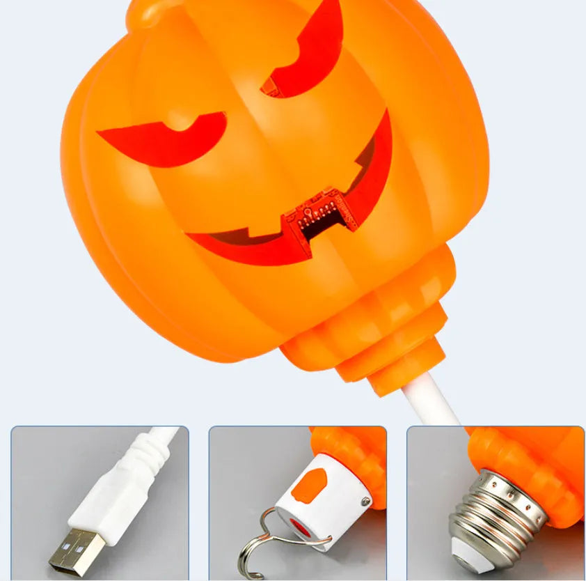 Plastic pumpkin-shaped USB lamp emitting purple or yellow light, 8.3cm wide.
