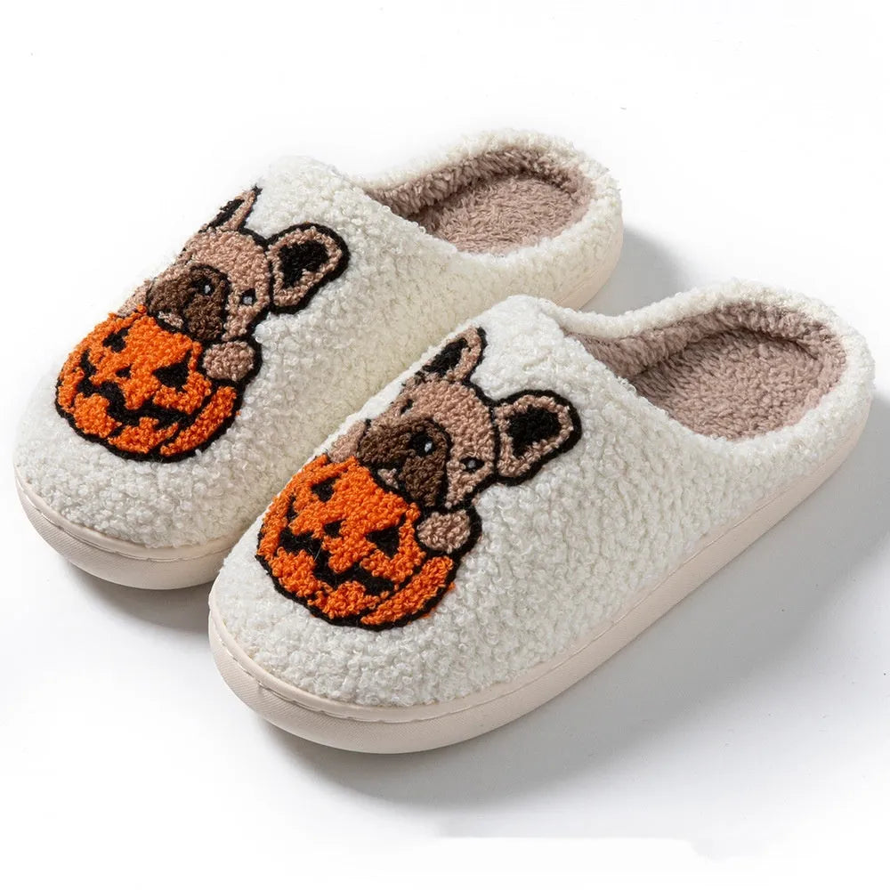 Halloween pumpkin slippers in black or white with plush material and rubber soles