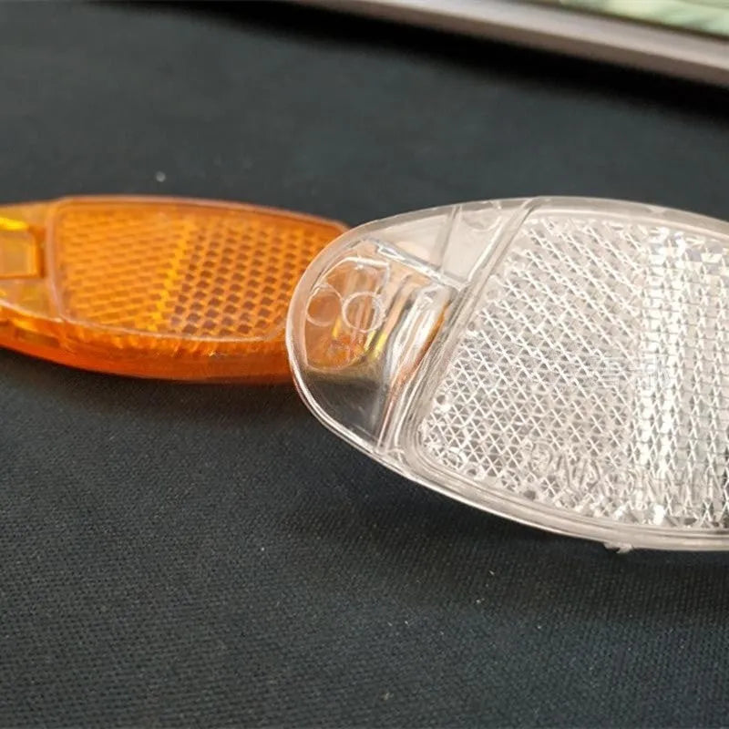 White and yellow plastic bicycle spoke reflector for front and rear wheel safety