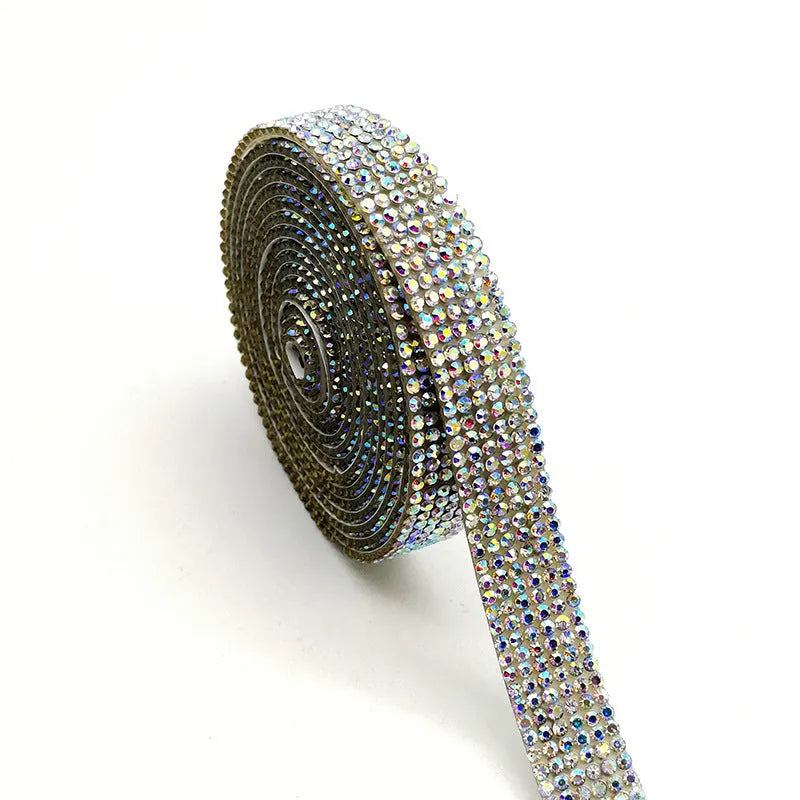 Self-adhesive glass rhinestone strip on a roll showing white and AB colour options.