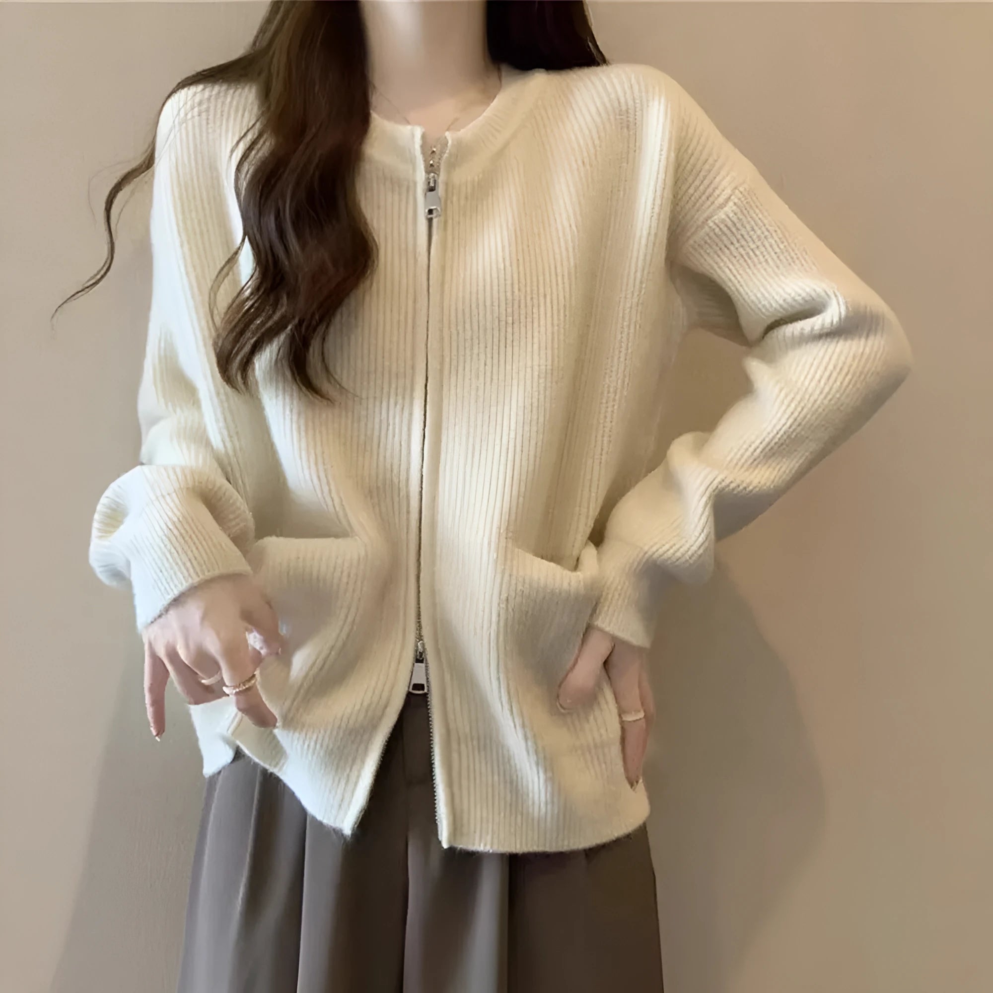Beige soft glutinous sweater coat cardigan with long sleeves on hanger