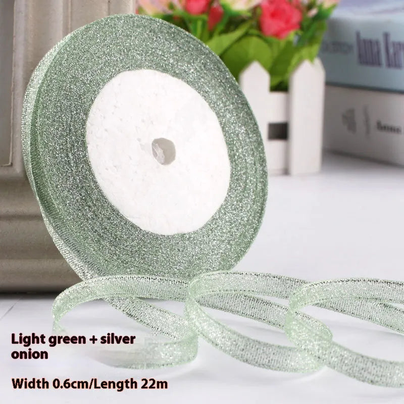 Roll of polyester gift ribbon showing 0.6cm width and multiple colour options including metallic finishes