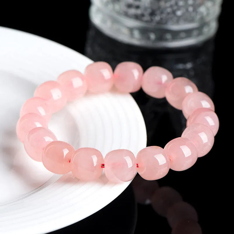 Pink crystal barrel bead bracelet with 8x10mm geometry pattern design