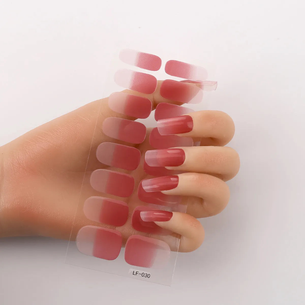 Sheet of 16 solid colour nail art sticker designs including cross, rose, and leopard print patterns.
