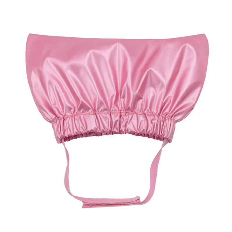 A silver adjustable waterproof shower cap for a dog or cat on a non-woven fabric background.