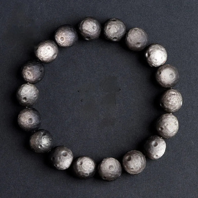 Natural crater ball bracelet featuring gold obsidian and silver stone meteorite beads in various sizes from 9mm to 16mm