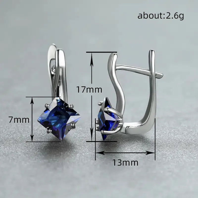 A pair of women's copper earrings with an inlaid zircon diamond design, shown in blue, green, and colour variations.