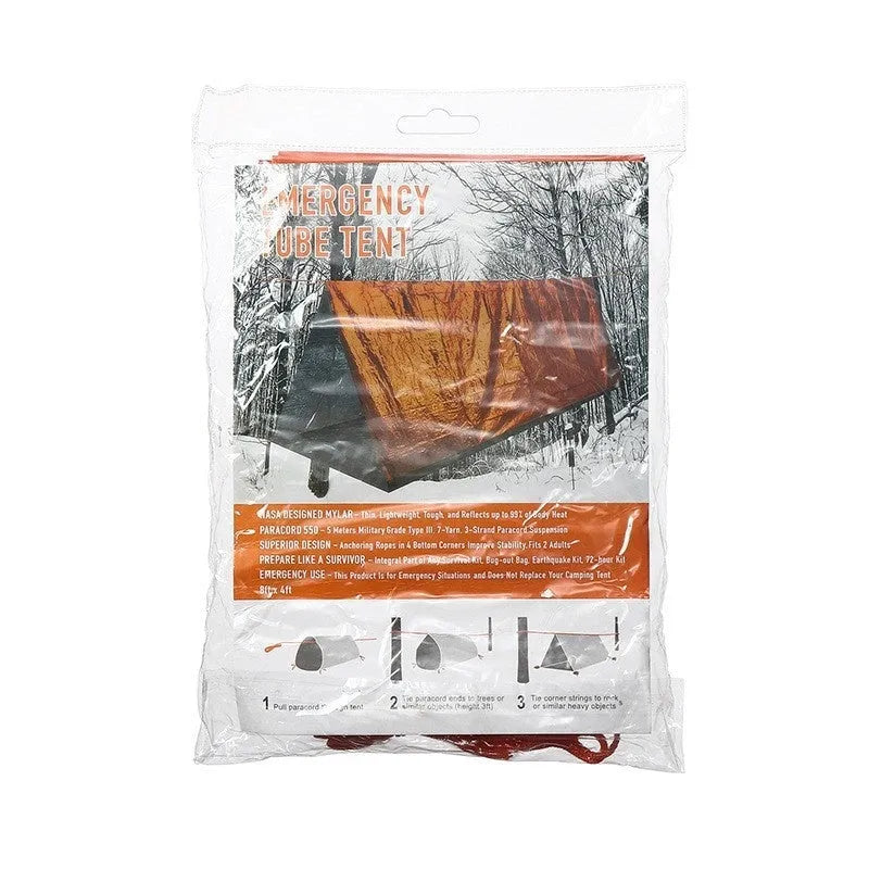 Orange portable disaster relief tent and sleeping bag kit set up outdoors.