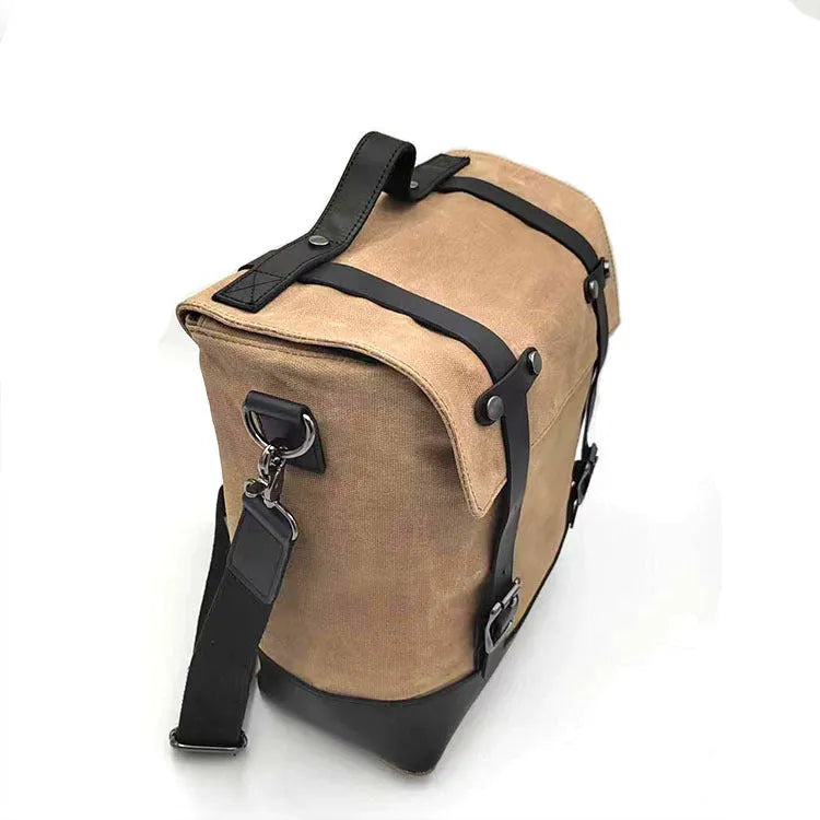Thick waterproof canvas motorcycle side bag showing dimensions and black colour option