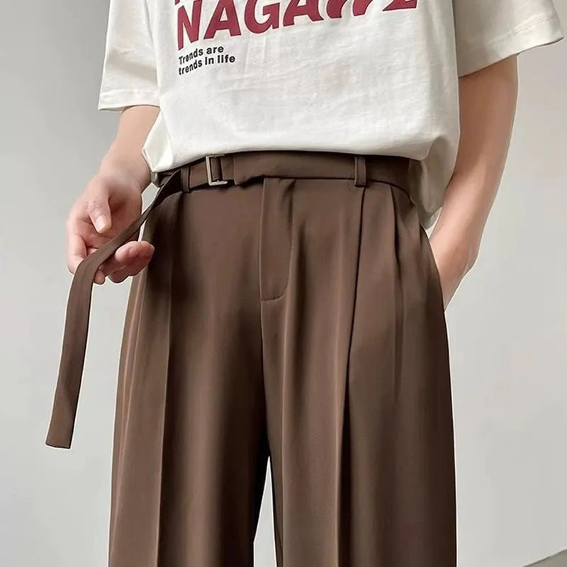 Thin straight black wide leg loose trousers laid flat, showing non-ironing casual style.