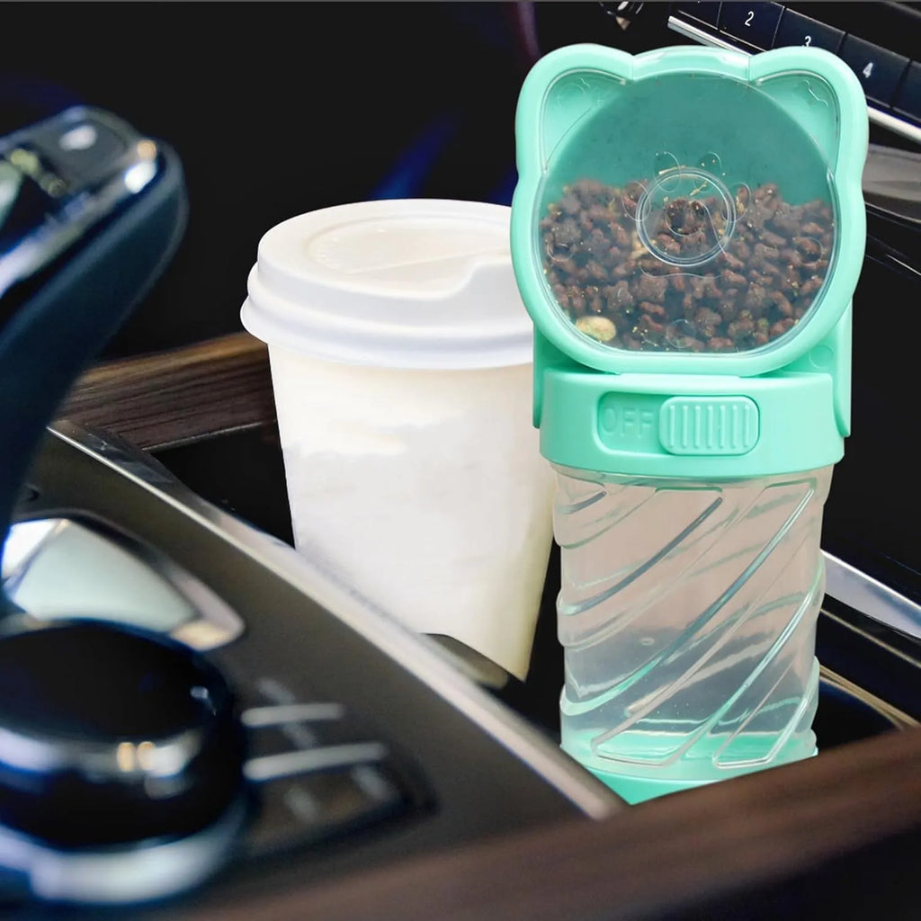Green, pink, or white 3-in-1 portable pet water bottle with attached strap, food container, and bag dispenser.