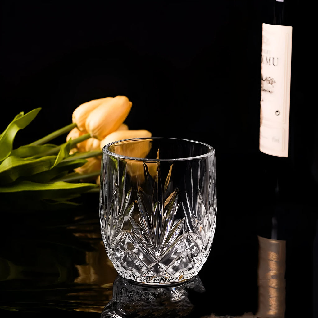 Crystal clear 330ml whiskey shot glass with a thick base, shown in an amber colour style.