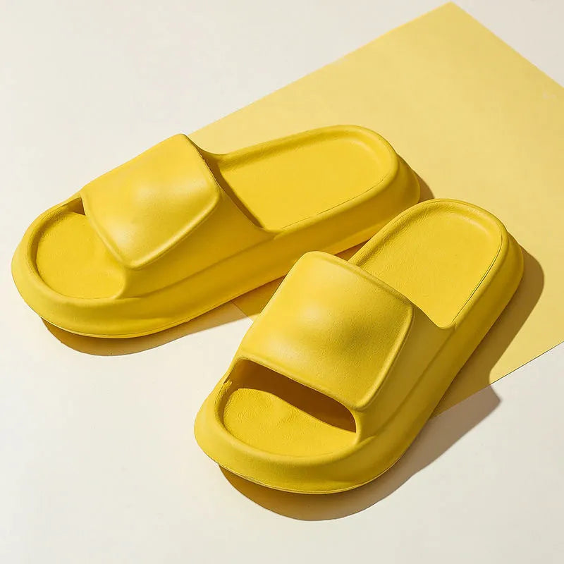 Thick sole EVA flip flop slippers in multiple colours on a white background.