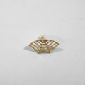 A pair of geometric spider web design stud earrings in an electroplated gold finish.