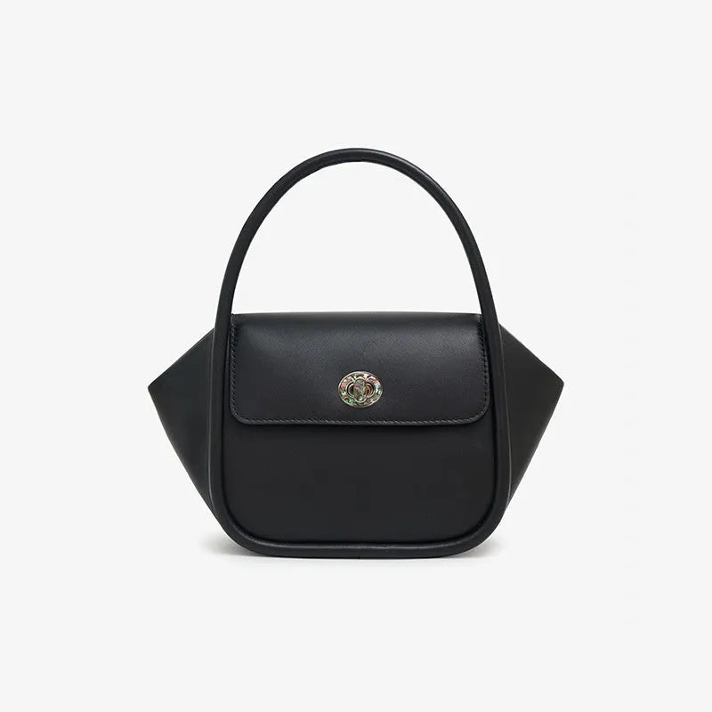 A soft cow leather wing-shaped tote handbag with a buckle and shoulder strap in black.