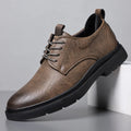 Men's black and brown leather casual sneaker with rubber sole and decorative sewing line detailing